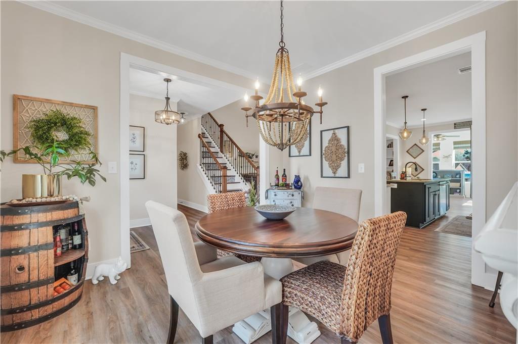 230 Alcovy Reserve Way Covington, GA 30014 - Photo 14 of 53 a view of a dining room with furniture and wooden floor