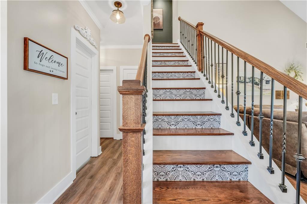 230 Alcovy Reserve Way Covington, GA 30014 - Photo 15 of 53 a view of entryway and hall with wooden floor