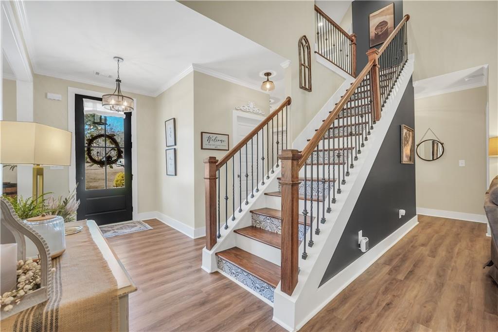 230 Alcovy Reserve Way Covington, GA 30014 - Photo 16 of 53 a view of entryway and hall with wooden floor