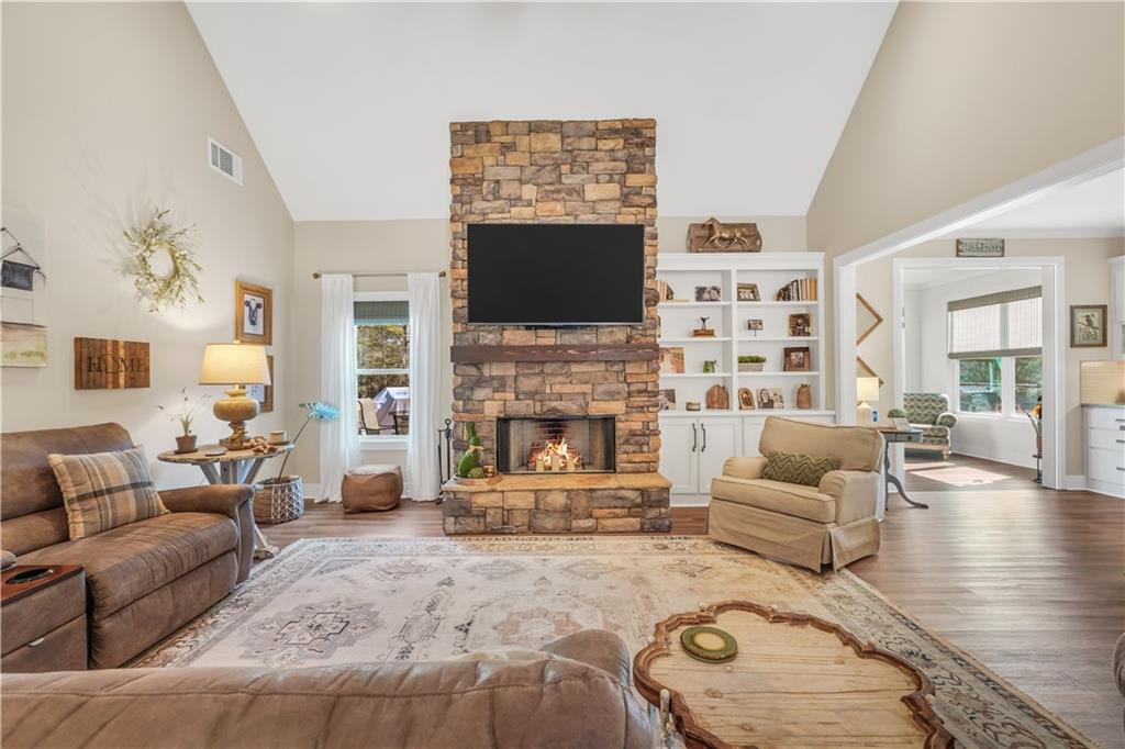 230 Alcovy Reserve Way Covington, GA 30014 - Photo 21 of 53 a living room with furniture a flat screen tv and a fireplace