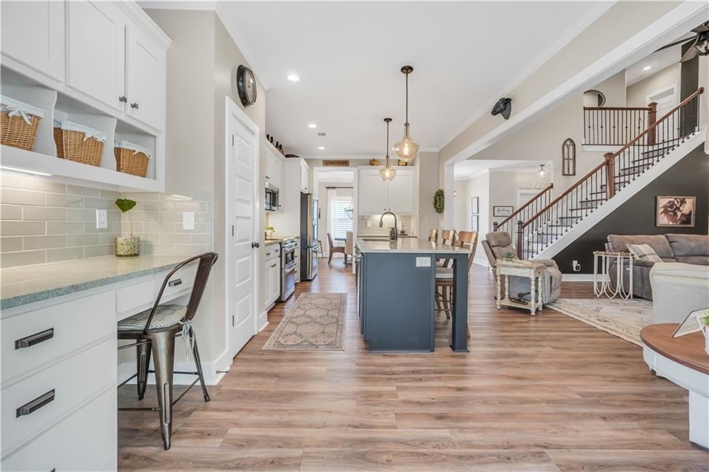 230 Alcovy Reserve Way Covington, GA 30014 - Photo 22 of 53 a living room with lots of furniture and a wooden floors