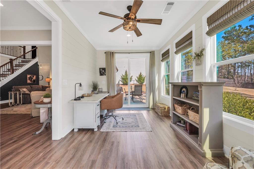 230 Alcovy Reserve Way Covington, GA 30014 - Photo 30 of 53 a living room with furniture and a wooden floor