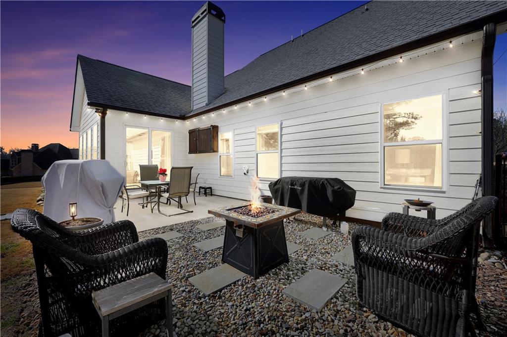 230 Alcovy Reserve Way Covington, GA 30014 - Photo 3 of 53 a living room with furniture a flat screen tv and a window