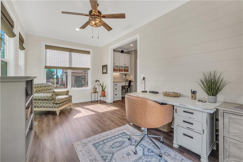 230 Alcovy Reserve Way Covington, GA 30014 - Photo 31 of 53 a living room with furniture a window and a potted plant