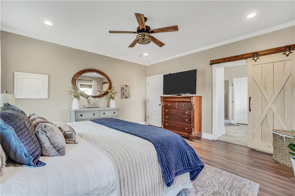 230 Alcovy Reserve Way Covington, GA 30014 - Photo 37 of 53 a bedroom with a bed and a flat screen tv