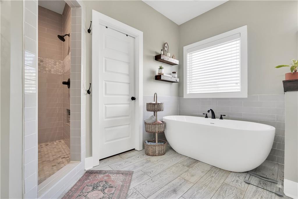 230 Alcovy Reserve Way Covington, GA 30014 - Photo 43 of 53 a bathroom with a bathtub and shower