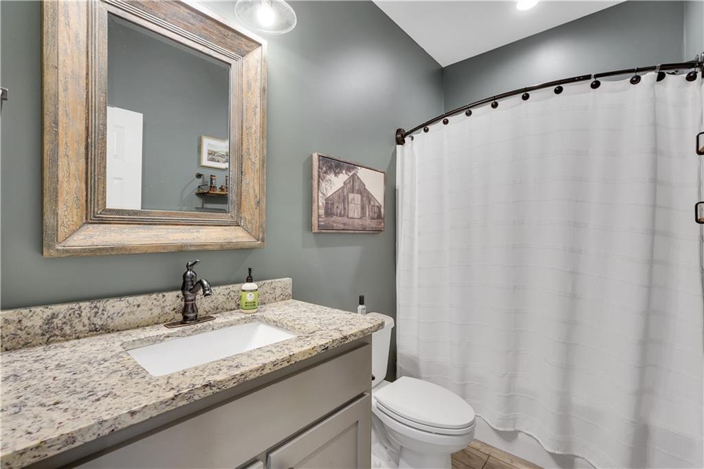 230 Alcovy Reserve Way Covington, GA 30014 - Photo 46 of 53 a bathroom with a granite countertop sink and a mirror