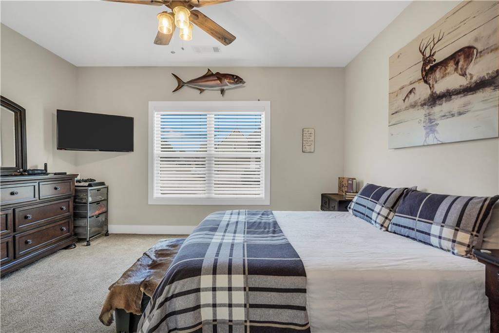 230 Alcovy Reserve Way Covington, GA 30014 - Photo 48 of 53 a bedroom with a bed and a flat screen tv