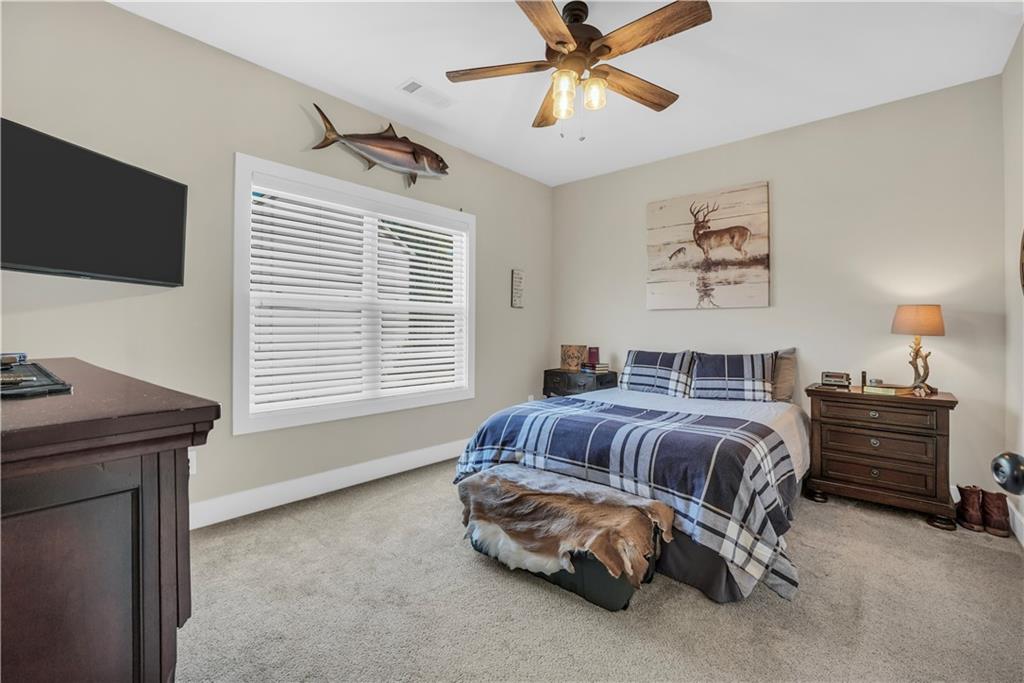 230 Alcovy Reserve Way Covington, GA 30014 - Photo 49 of 53 a bedroom with a bed and a television