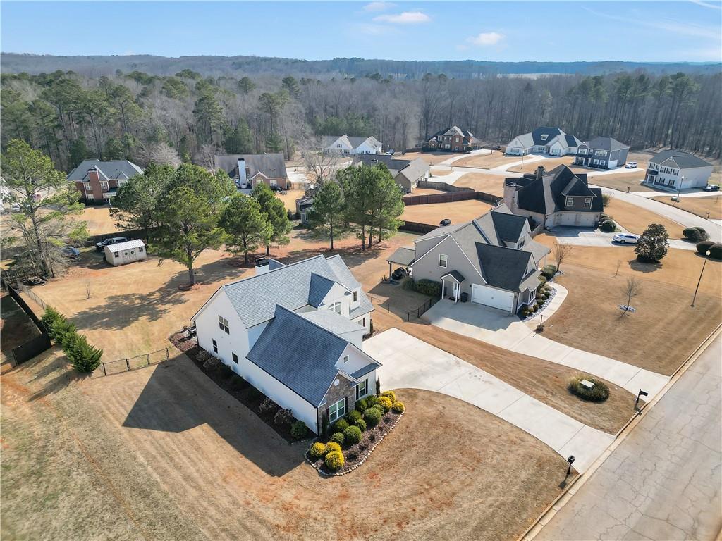 230 Alcovy Reserve Way Covington, GA 30014 - Photo 8 of 53 an aerial view of a house with a yard and lake view