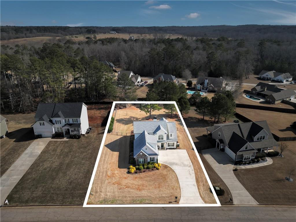 230 Alcovy Reserve Way Covington, GA 30014 - Photo 9 of 53 a view of a backyard with couches chair and fire pit