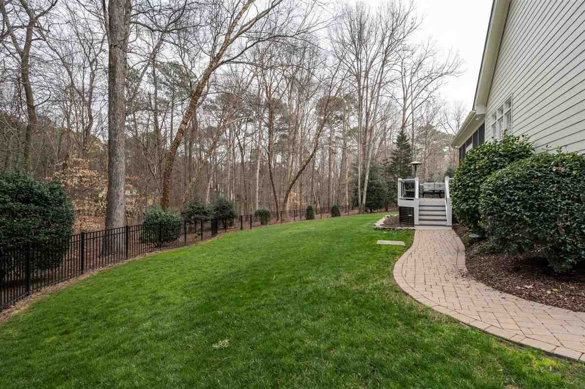 4616 Hidden Harbor Lane Raleigh, NC 27615 - Photo 3 of 30 Nicely landscaped spacious fenced in backyard.