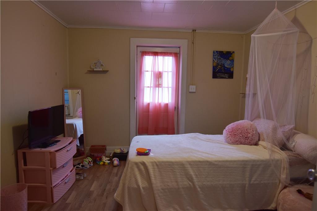 520 Brinton Avenue Trafford, PA 15085 - Photo 16 of 23 a bedroom with a bed and window