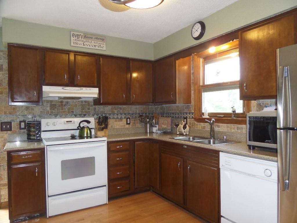 576 Main Road Eddington, ME 04428 - Photo 2 of 29 hardwood and solid stone counters...
