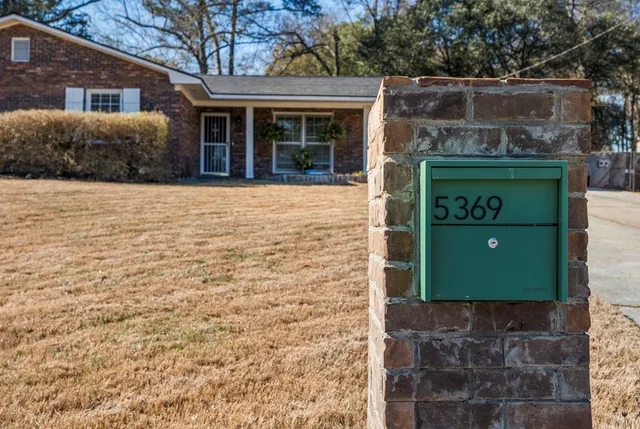 a front view of a house with a swing