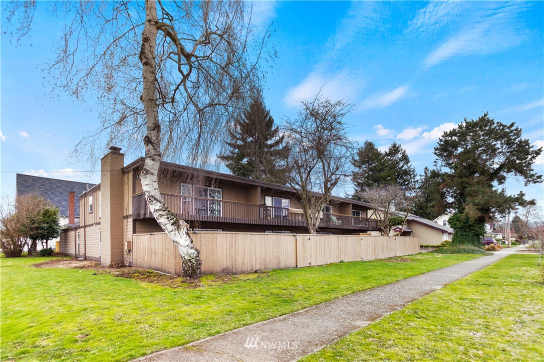 1103 Thompson Street Sumner, WA 98390 - Photo 2 of 29 a view of a house with a yard