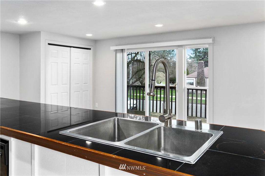 1103 Thompson Street Sumner, WA 98390 - Photo 14 of 29 a kitchen with a sink and a large window