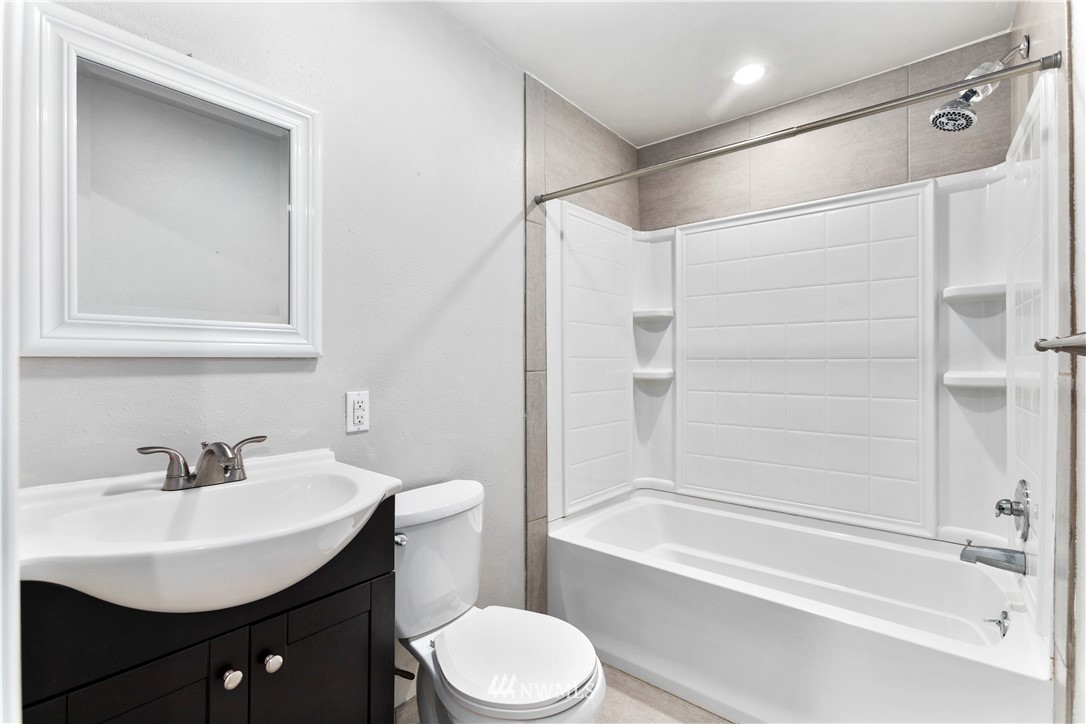 1103 Thompson Street Sumner, WA 98390 - Photo 21 of 29 a bathroom with a sink toilet and shower