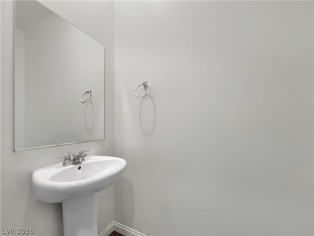 9984 Indigo Cliffs Street Las Vegas, NV 89141 - Photo 9 of 31 Bathroom with a sink