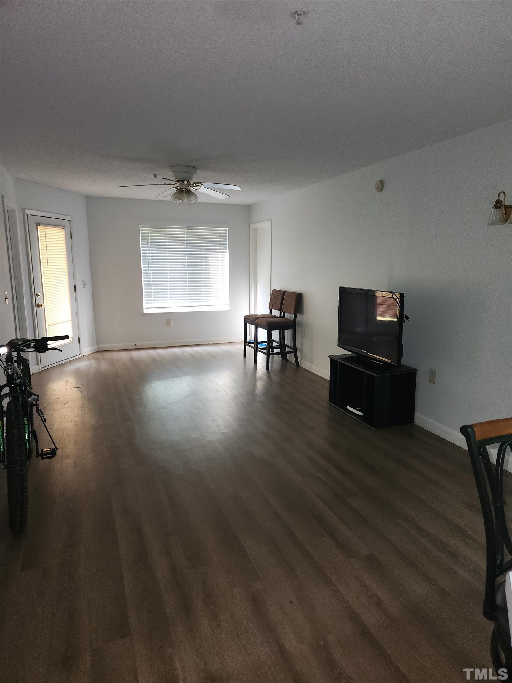 1440 Collegiate Circle, Unit 103 Raleigh, NC 27606 - Photo 4 of 10 a view of a workspace with furniture and a window