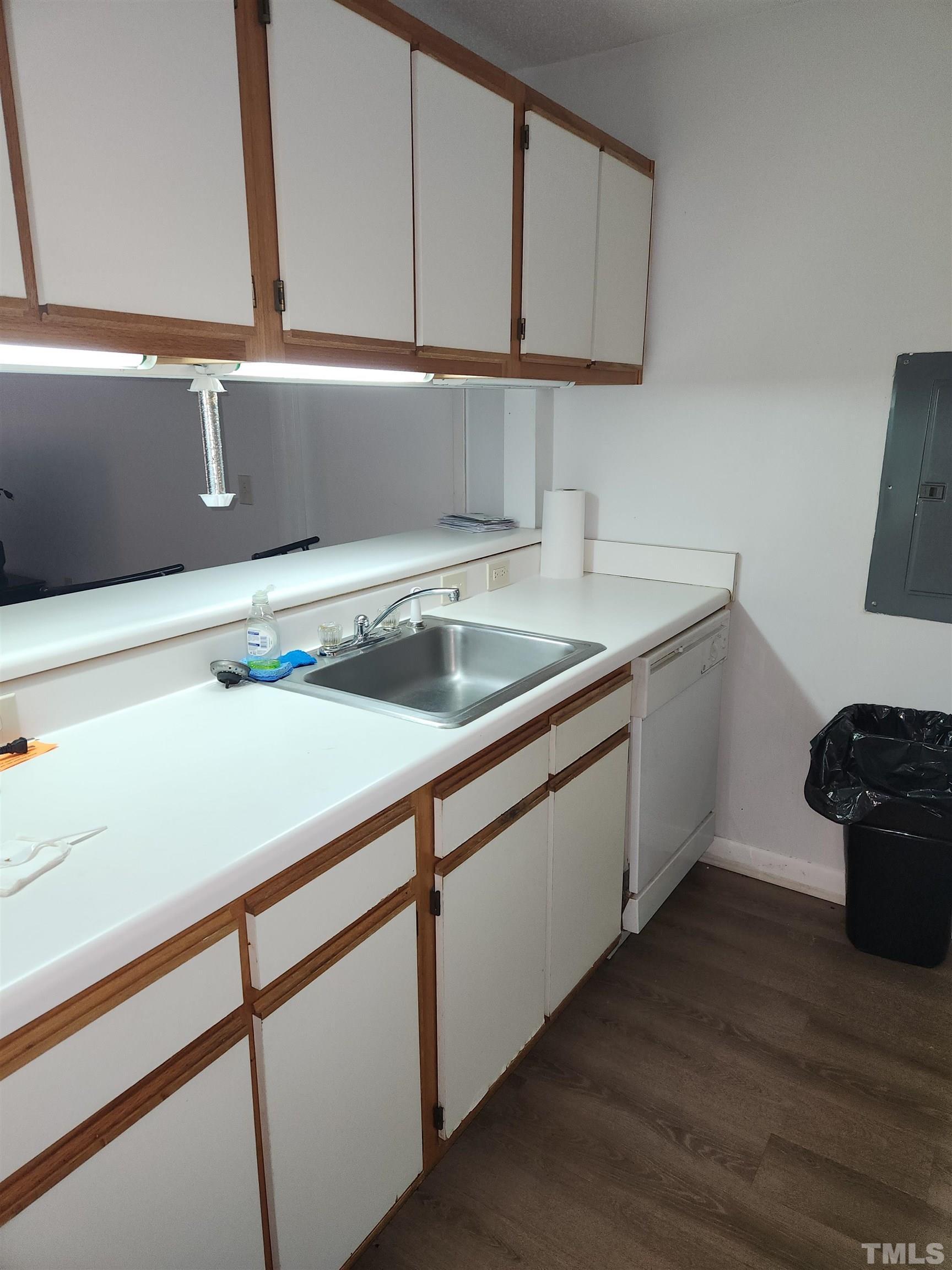 1440 Collegiate Circle, Unit 103 Raleigh, NC 27606 - Photo 5 of 10 a kitchen with a sink and a cabinets