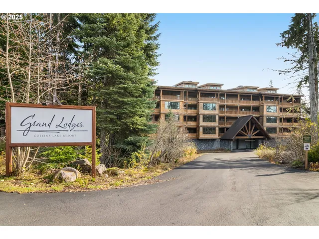 a view of a blue house with a outdoor space