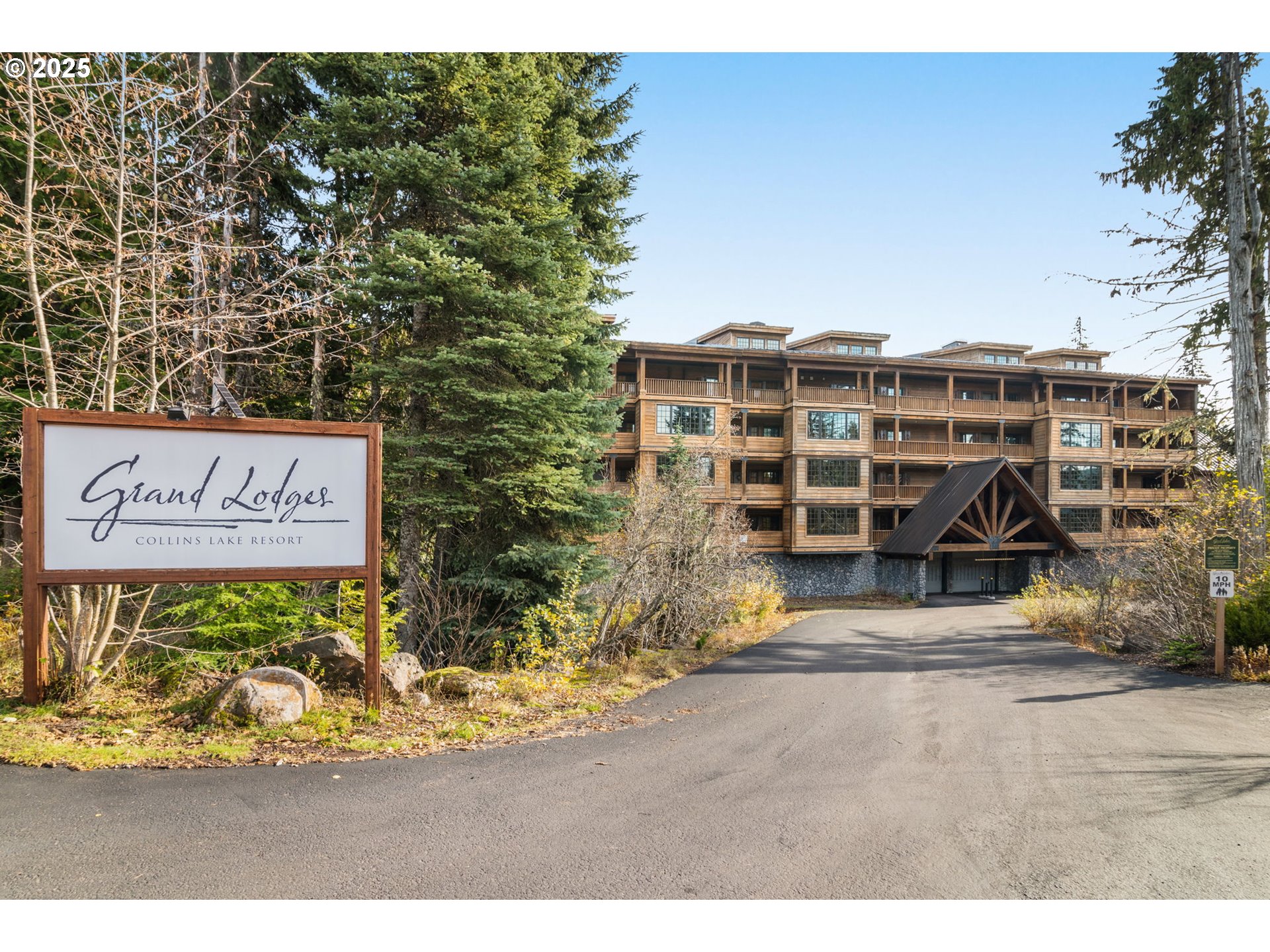 a view of a blue house with a outdoor space