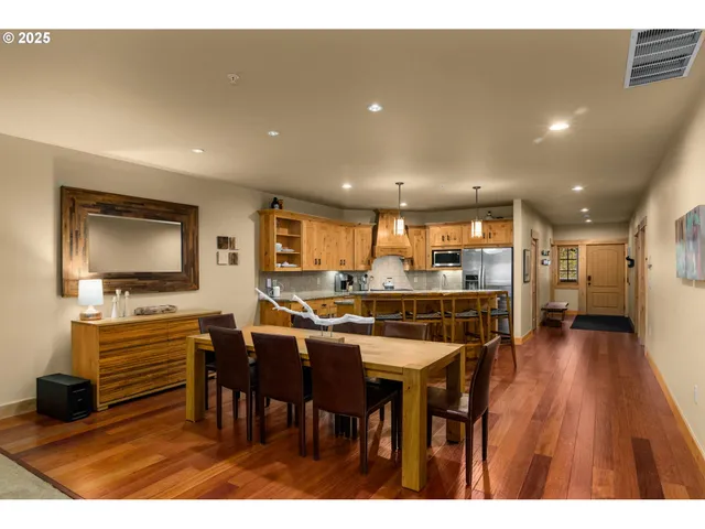 a kitchen with a table and chairs in it