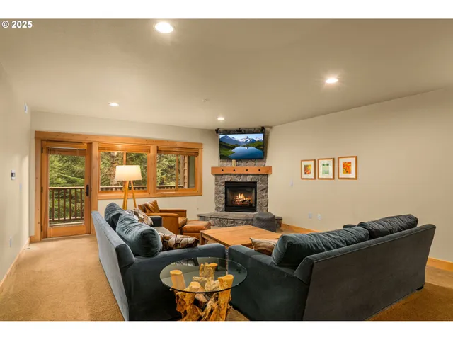 a balcony with wooden floor and outdoor seating