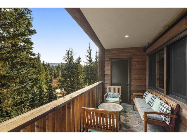 a view of balcony with furniture