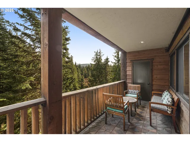 a bedroom with a bed window and a table in it