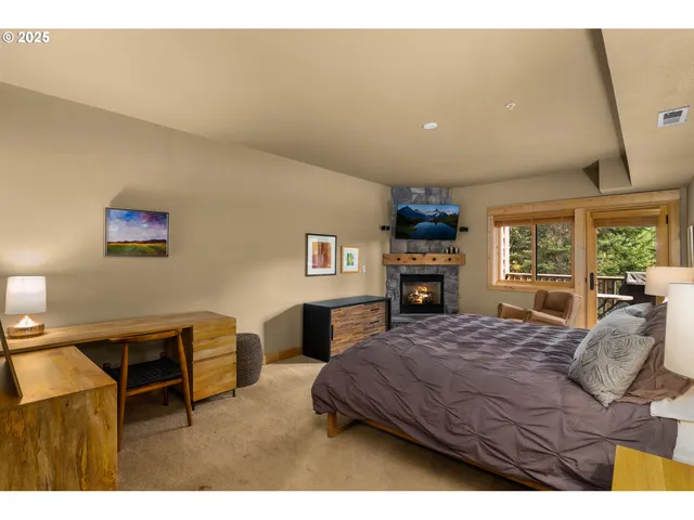 a bed room with a bed and a television