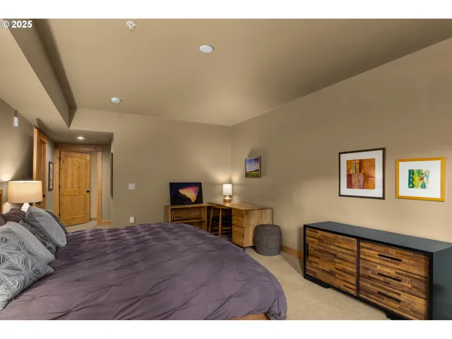 a bedroom with a bed and a cabinets