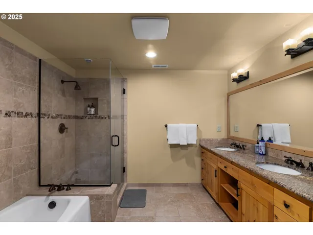 a bathroom with a granite countertop sink a mirror and a