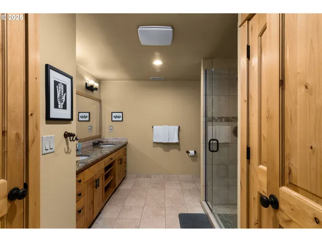 a bedroom with furniture and the view of bathroom