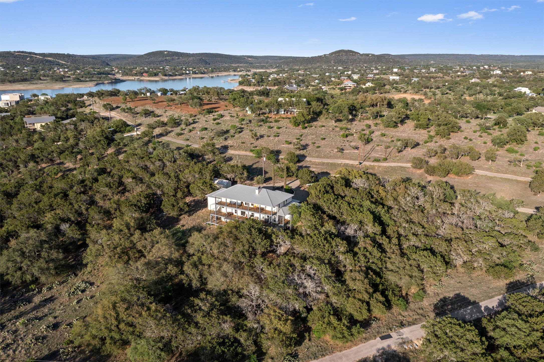 4401 Sunset Cliff Road Burnet, TX 78611 - Photo 32 of 40 Birds eye view of property with a water and mountain view