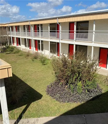 a view of swimming pool with an outdoor seating