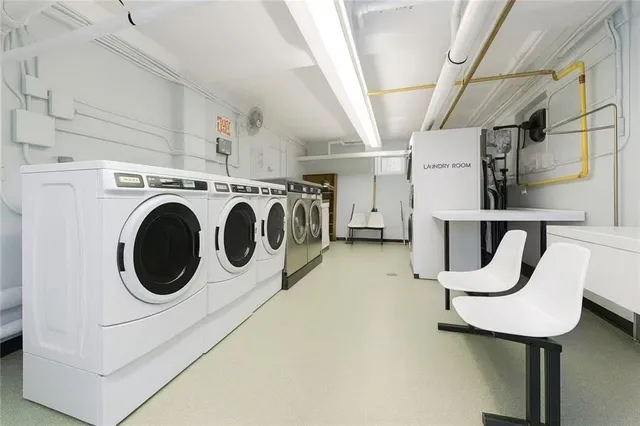 a view of a big building with a big yard and plants