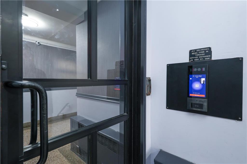 6801 Shore Road, Unit 2T Brooklyn, NY 11220 - Photo 2 of 20 a view of livingroom with furniture and flat screen tv