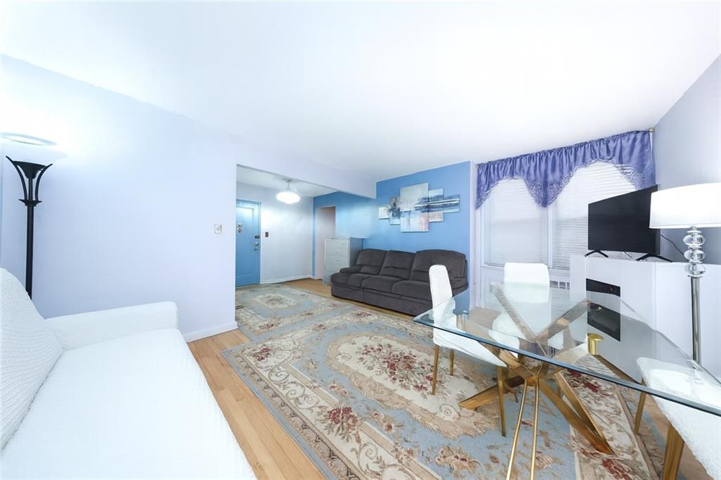 6801 Shore Road, Unit 2T Brooklyn, NY 11220 - Photo 5 of 20 a bedroom with a bed and flat screen tv