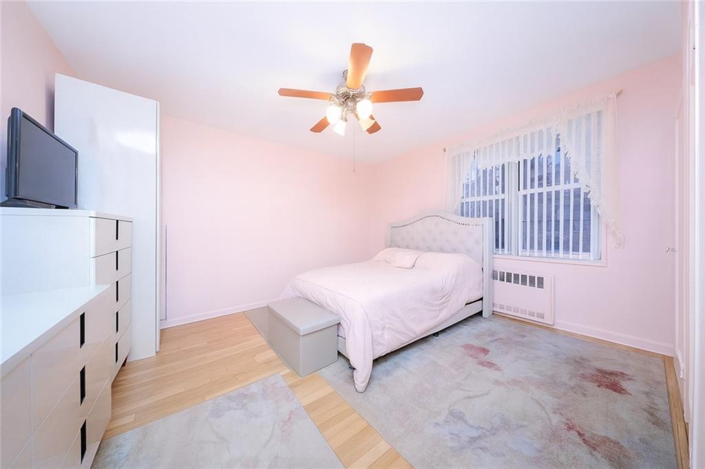 6801 Shore Road, Unit 2T Brooklyn, NY 11220 - Photo 7 of 20 a bedroom with a bed and a window