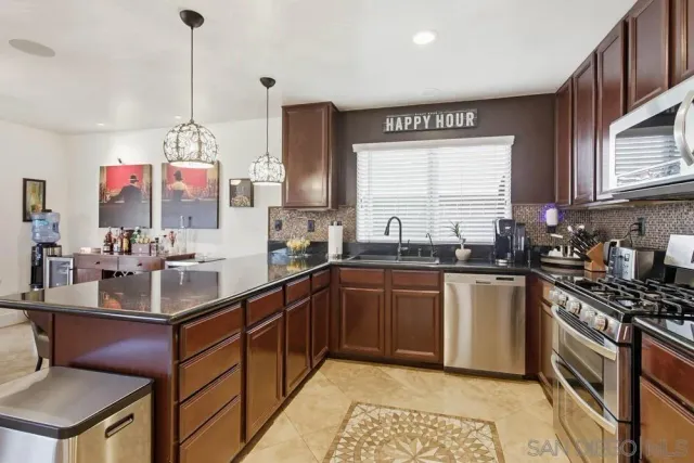 a view of a living room and chandelier