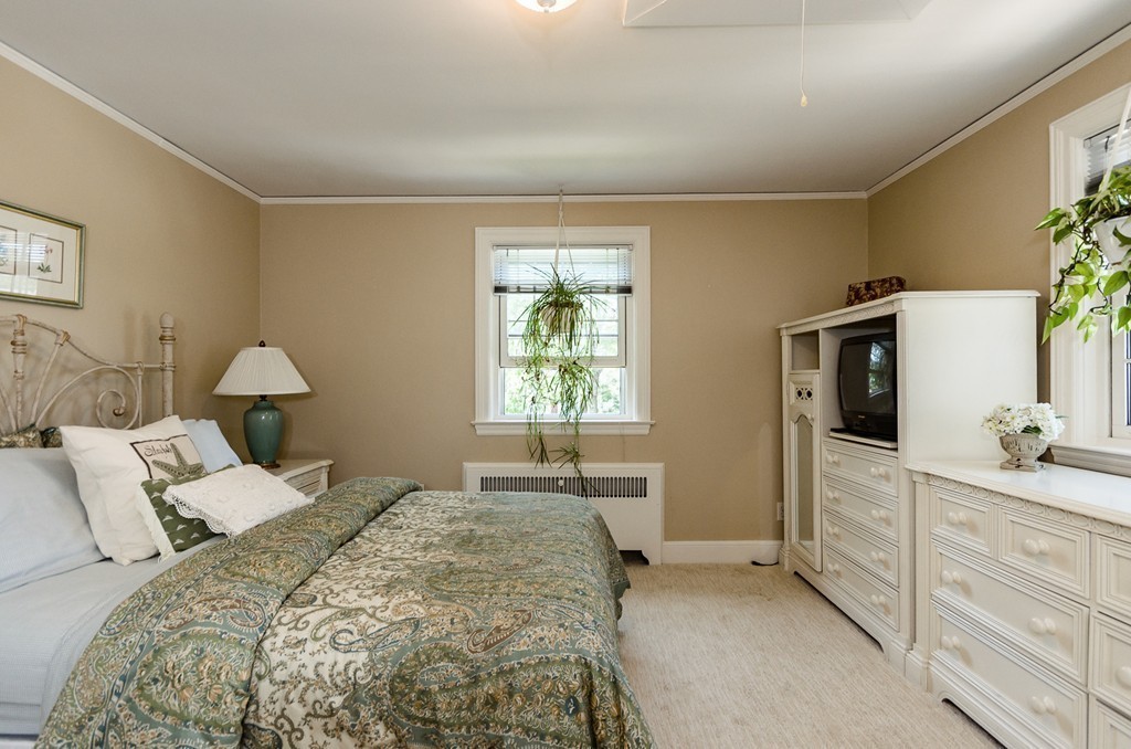 36 Sheldon Road Newton, MA 02459 - Photo 11 of 16 a bedroom with a bed and a dresser