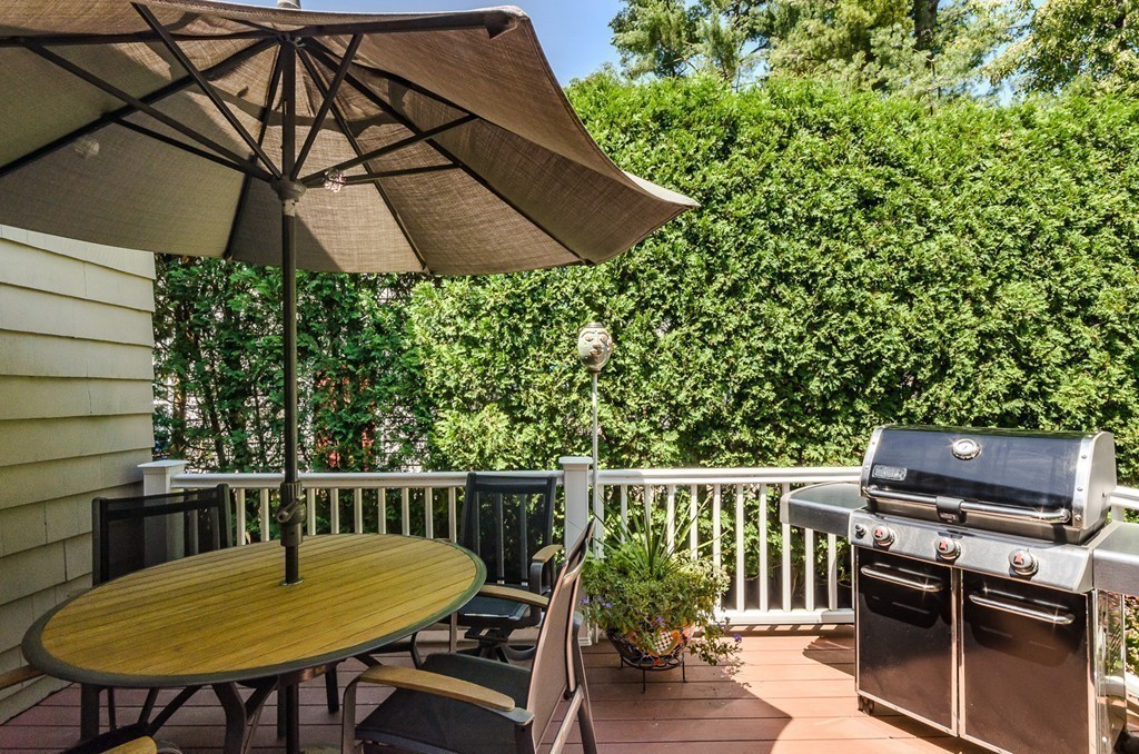 36 Sheldon Road Newton, MA 02459 - Photo 13 of 16 a balcony with a table and chairs