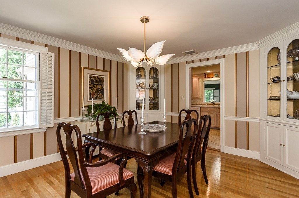 36 Sheldon Road Newton, MA 02459 - Photo 4 of 16 a dining room with furniture a chandelier and wooden floor