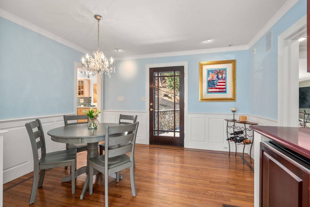 80 Fenwick Road Newton, MA 02468 - Photo 11 of 35 a view of a dining room with furniture wooden floor and chandelier
