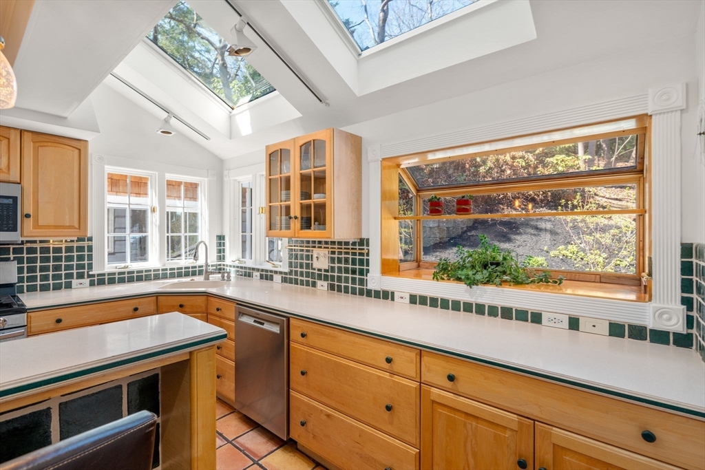 80 Fenwick Road Newton, MA 02468 - Photo 13 of 35 a view of a kitchen with a sink and cabinets