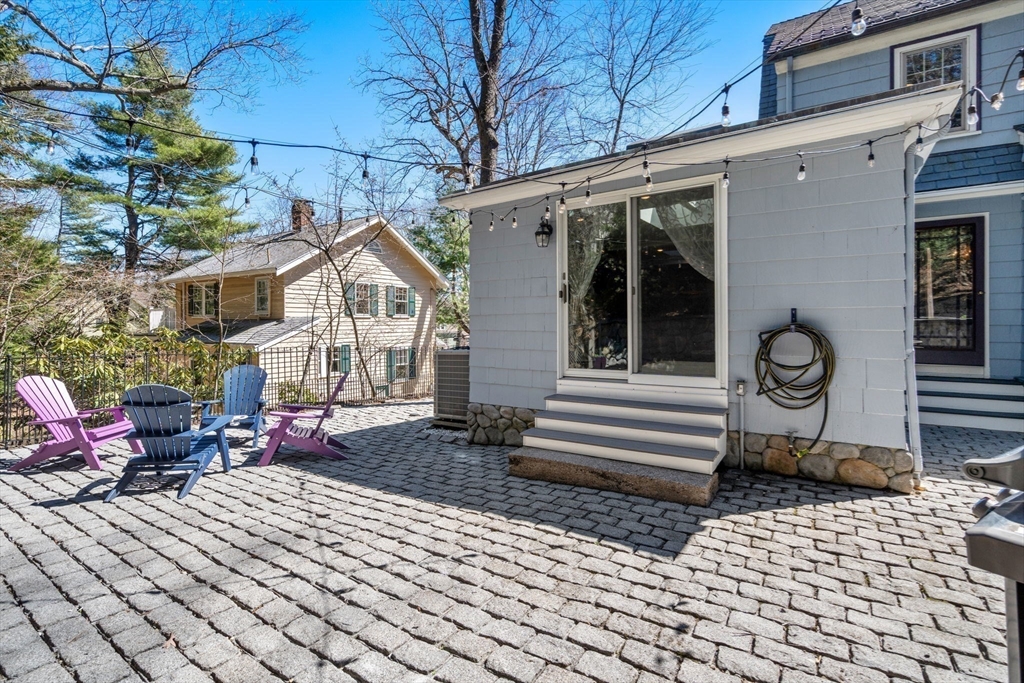 80 Fenwick Road Newton, MA 02468 - Photo 30 of 35 a view of a house with a small yard and wooden floor and fence