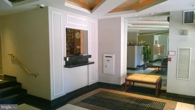 a bedroom with a bed and a rug