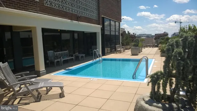 a outdoor space with pool and furniture